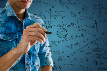 Man writing math formulas on the screen - obrazy, fototapety, plakaty