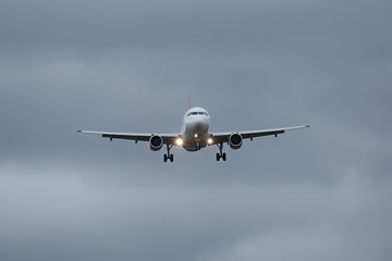 Plane approaching with landing lights