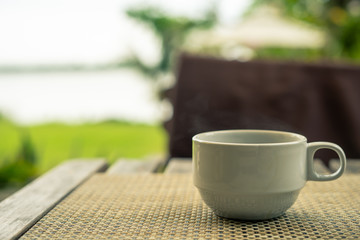 cup of coffee on wooden table