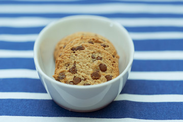 Homemade chocolate cookies in a porcelain plate. Closeup.