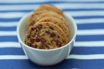 Homemade chocolate cookies in a porcelain plate. Closeup.