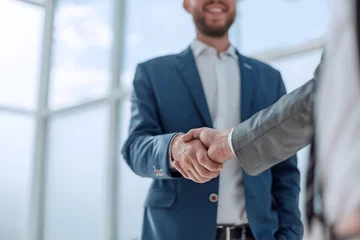 Foto op Plexiglas business partners shaking hands . concept of partnership © ASDF