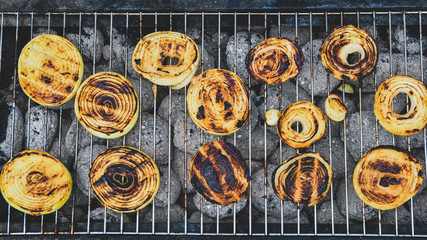 grilled onions in a black plate