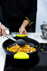 Chefs placing the menu items to their customers