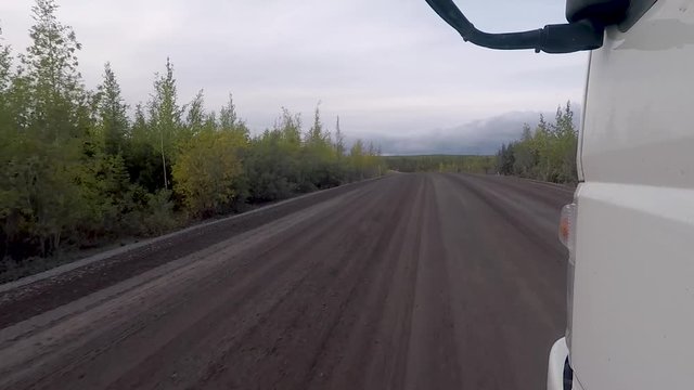 Low front pov shot of a 4x4 truck driving off-road in the Dempster Highway in Canada.