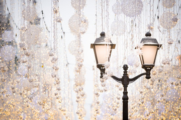 An infinite number of garlands in the center of evening Moscow. Lighted street lights and garlands on Nikolskaya street before Christmas. Christmas and New Year concept.