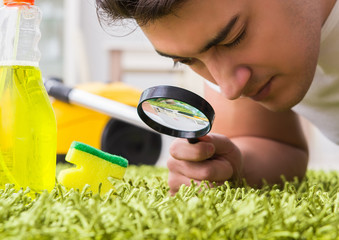 Young husband man cleaning floor at home