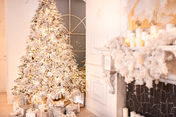 Background christmas interior New Year tree and artificial fireplace decorated light for holiday, white color