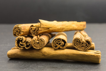 heap of cinnamon sticks - cinnamomum verum