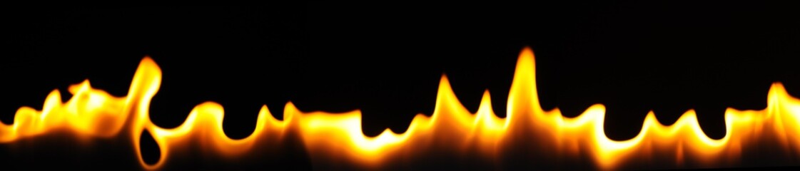 Close-up flames of an alcohol burner on a dark background