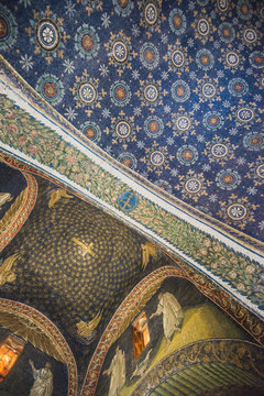 RAVENNA, ITALY - September 11, 2019: Travel view of Ravenna featuring Mausoleum Galla Placidia mosaic stars sky cross ceiling. The image location is Emilia Romagna in Italy, Europe.