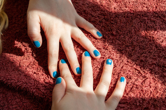 Vibrant Blue Painted Fingernails