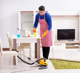 Contractor man cleaning house doing chores