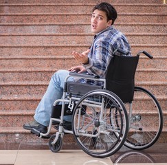 Disabled man on wheelchair having trouble with stairs