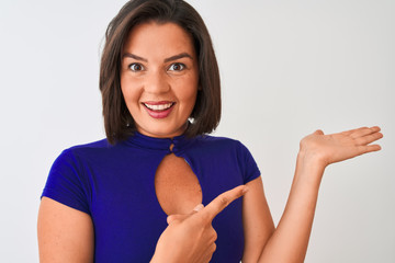 Young beautiful woman wearing blue elegant t-shirt standing over isolated white background very...