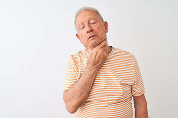 Obraz premium Senior grey-haired man wearing striped t-shirt standing over isolated white background Touching painful neck, sore throat for flu, clod and infection