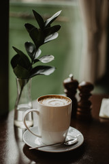 cup of morning coffee latte in a cafe on the table