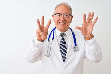 Senior grey-haired doctor man wearing stethoscope standing over isolated white background showing and pointing up with fingers number eight while smiling confident and happy.