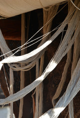 white yarns on the carpet loom