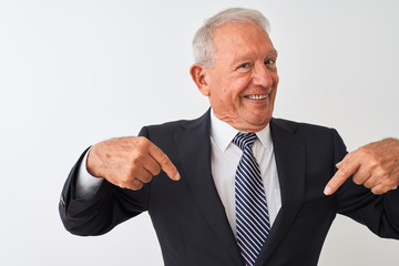 Senior grey-haired businessman wearing suit standing over isolated white background looking...