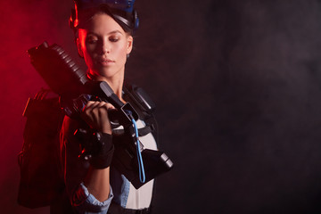 Portrait of woman amateur of virtual reality game, fight in process, professional shooter vr
