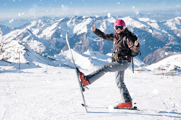 Young skier woman posing for the camera on french slopes