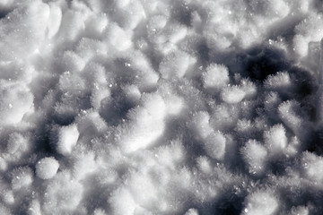 background of shiny frozen snow in a sunny day