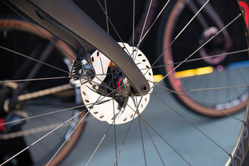 Detail of spokes and fork of professional bicycle wheel. Italian cycling tour June 2, 2019 in Verona, Italy.