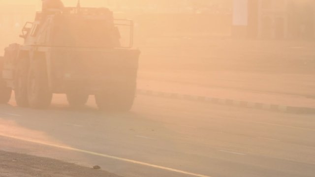 Military explosion, fighting, war and chaos. Tanks driving by through the smoke and destruction. Military concept. 