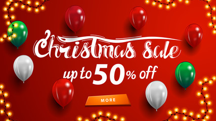 Fototapeta na wymiar Christmas sale, up to 50% off, red discount banner with garland, button and balloons near wall