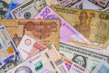 Fototapeta na wymiar Multi currency background. Euro, american dollars, ukrainian hryvnias, egyptian pounds, russian roubles