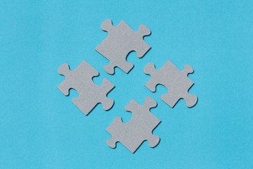 Puzzle pieces on blue background.