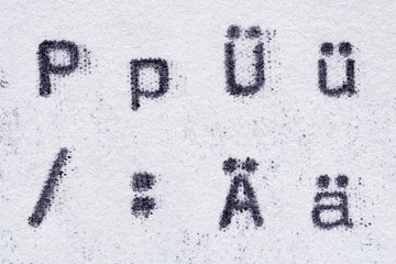Real typewriter font alphabet with letters P, Ü, Ä and symbols  slash, colon