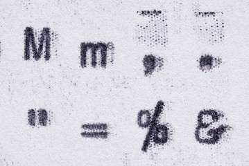 Real typewriter symbols on white paper