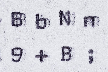Real typewriter font alphabet with letters B, N, ß, digit 9 and semicolon