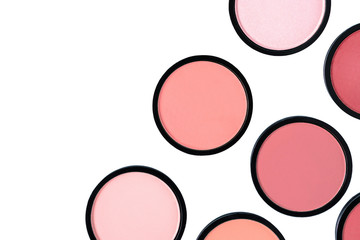 Coral blush and compact powder on white background. Isolated. Beautiful colorful beauty template. Trending shades. Makeup. Cosmetic products. Flat lay