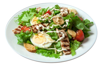 Caesar salad with grill chicken fillet isolated on white background