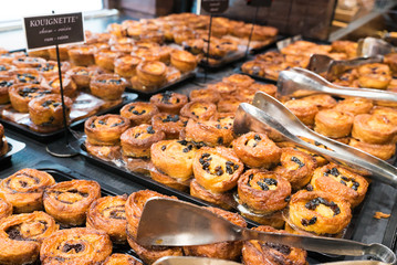 delicious typical Breton kouignette cakes in different styles in a bakery