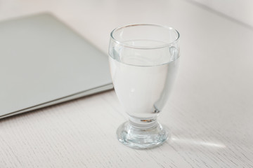 Glass of fresh water on table