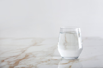 Glass of fresh water on table