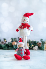 Christmas background with snowman, branches, ornaments , portrait image with empty space close up image