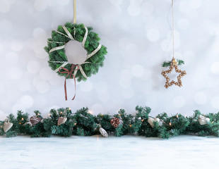 christmas background with branches, ornaments, festive decorations and wreath and start hanging in. 