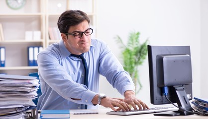 Tired businessman with too much paperwork