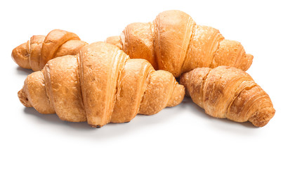 Sweet tasty croissants on white background