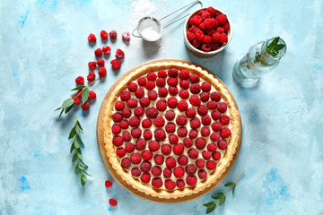 Tasty raspberry pie on color background