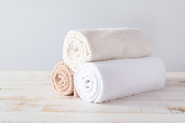 Fototapeta na wymiar Soft clean towels on wooden table