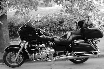 Fototapeta na wymiar Black motorcycle. Black and white photo. Style.