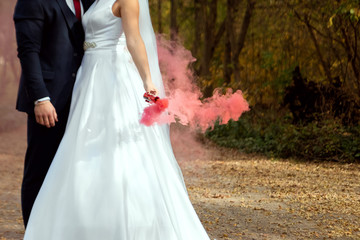 Fototapeta premium bride and groom for a walk. The concept of marriage, family relationships, wedding paraphernalia.