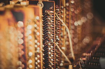 Vintage electronic circuit boards with radio parts and chips, close-up, macro photo