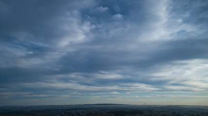 Obraz premium Aerial View of a Late Afternoon Sun With Partly Cloudy Blue Sky Over Farm Countryside Background